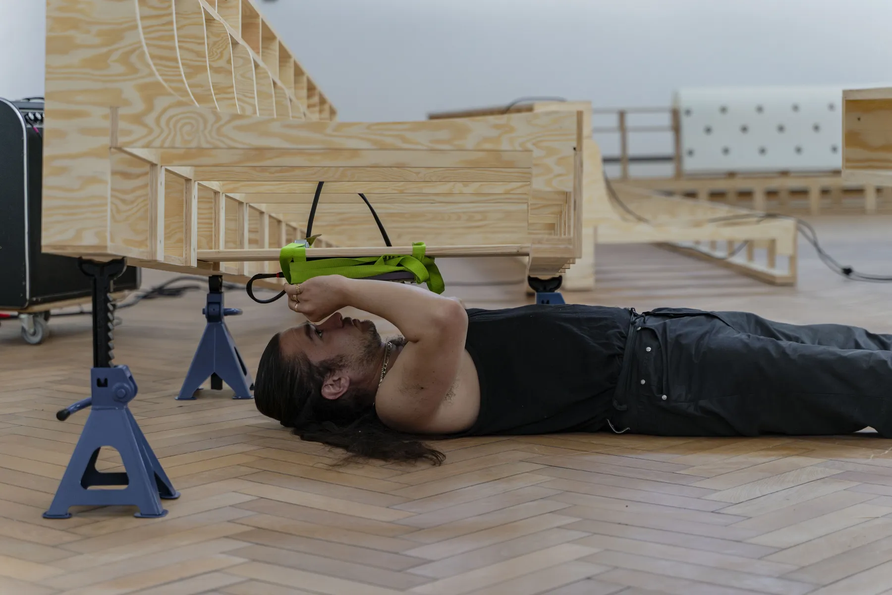 Detail of the wooden framework construction showing the artist's technical approach and spatial design at Trust Trust, Lübeck, 2025.